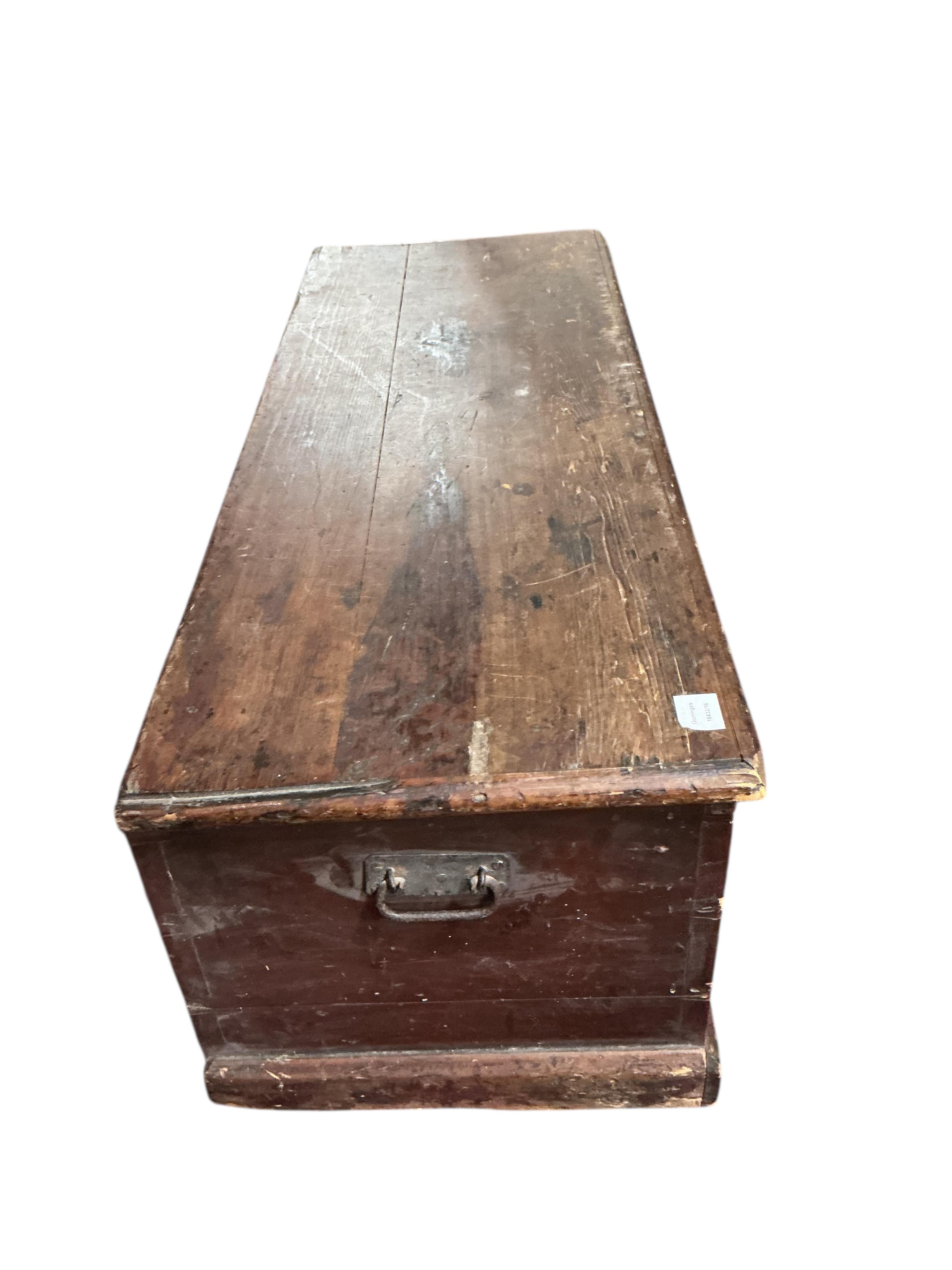 A 19th century rectangular pine trunk, width 124cm, depth 46cm, height 45cm